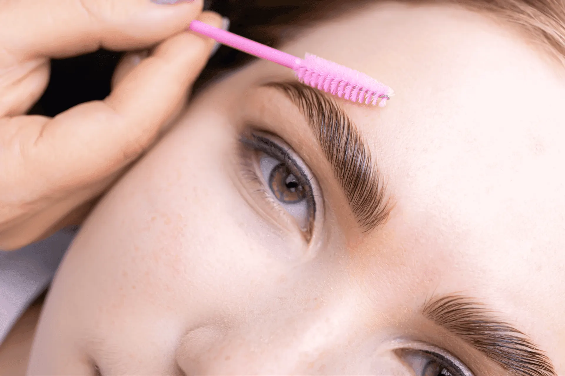 Abstract soft gradient background representing brow enhancement and grooming