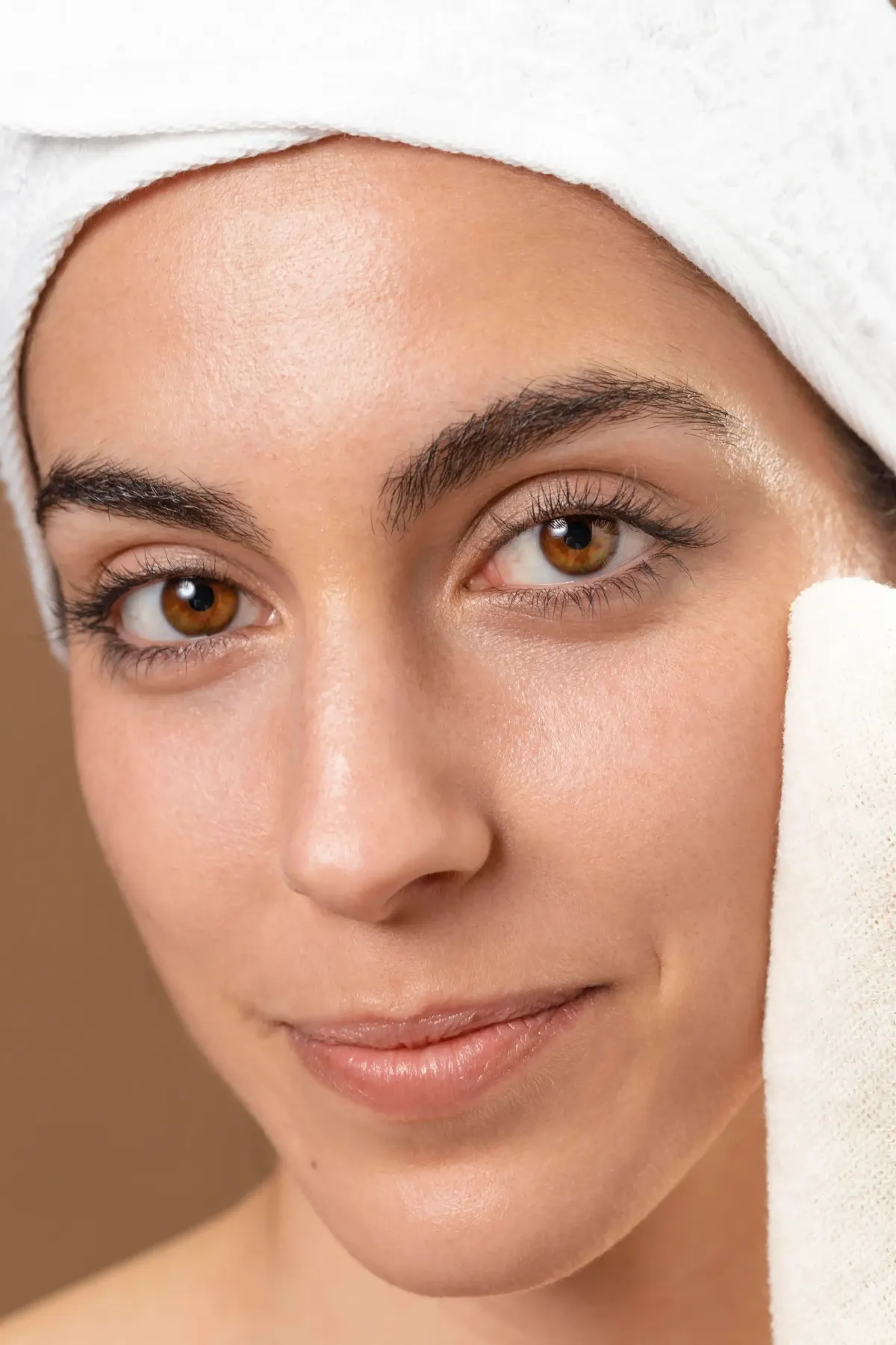 Close-up of skin showing enlarged pores and oily texture on the T-zone area