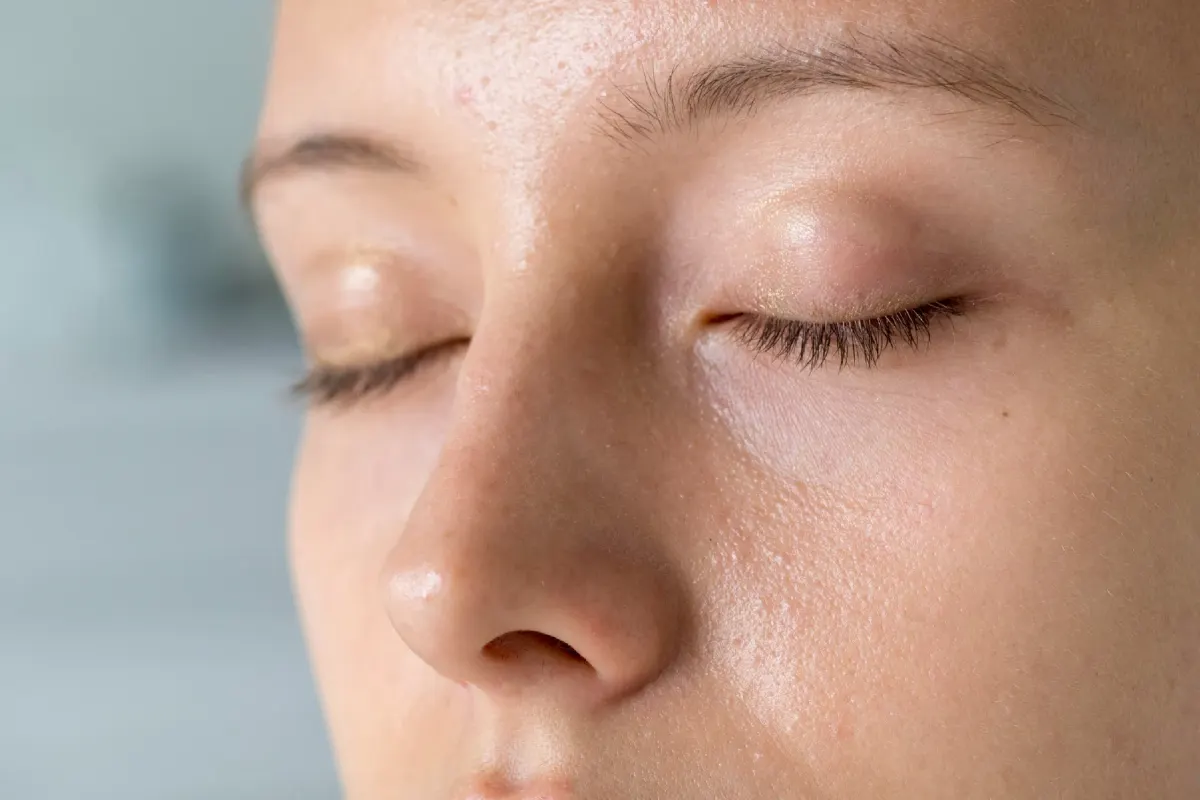 Woman with clear, balanced skin after oily skin and enlarged pore treatment at Eternal Wellness Medical Spa in Traverse City