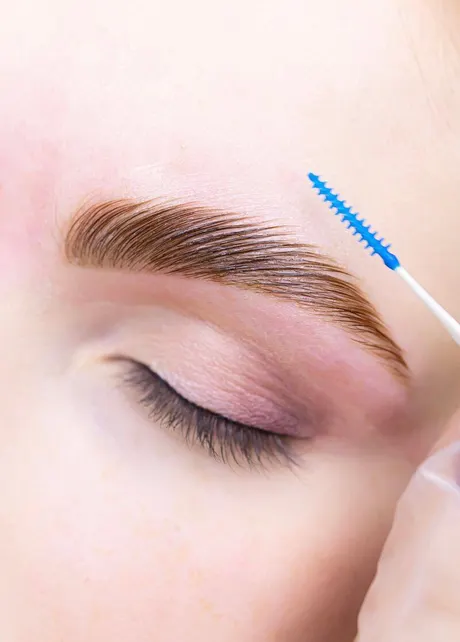 Patient consultation about brow lamination benefits at Eternal Wellness Traverse City